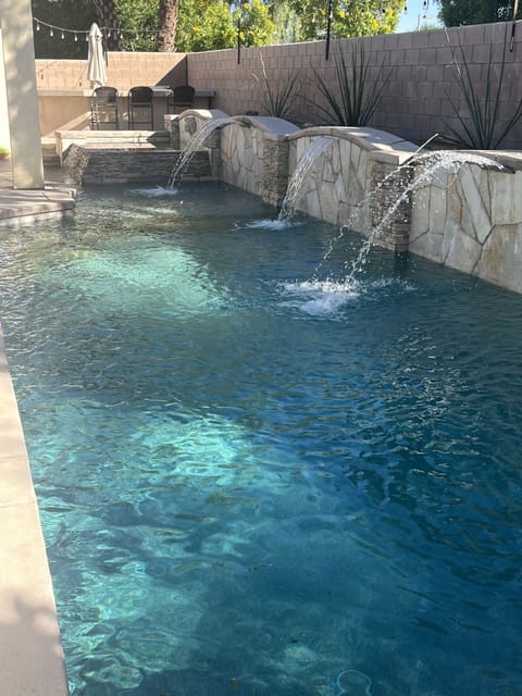 Sparking pool and hot tub large enough for 8+ with tanning shelf and umbrella 
