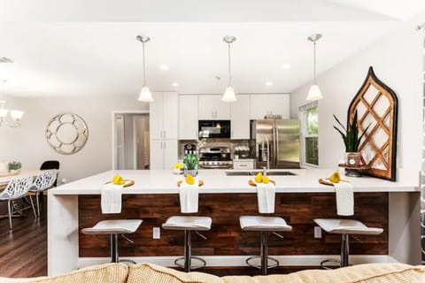 Fully stocked kitchen with a stylish and comfy bar stools