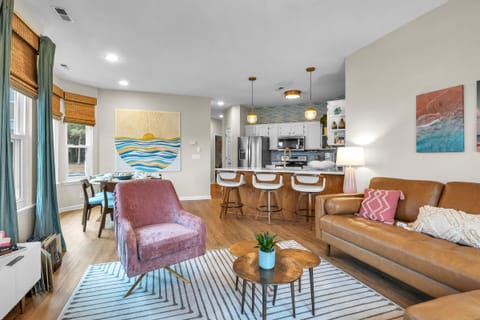 Livingroom-Cozy leather sofa and plush pink chair