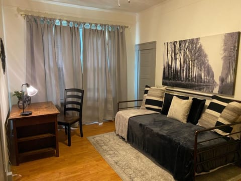 Guest room with desk and trundle, "passthrough" bedroom