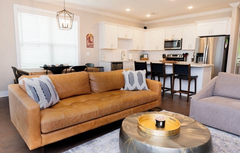 Living room, dining area and kitchen