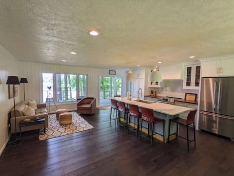 Open kitchen with sitting area and dining area.