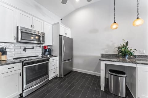 Fully stocked with cookware and dinnerware, this awesome kitchen is ready for all your culinary adventures.