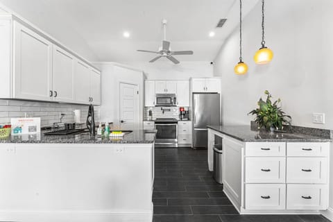 This kitchen is a chef`s dream – stocked with everything from cookware to dinnerware for all your cooking and dining needs.