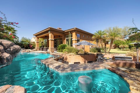 Backyard features natural landscaping so it feels like you're in a desert oasis.