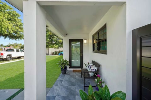 A small chair to relax in front of the front door with the street view. UNIT A