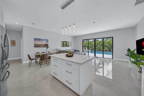 Open layout living room with gorgeous view of the pool