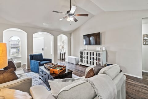 Spacious & comfortable family room with games & 55-inch smart tv.