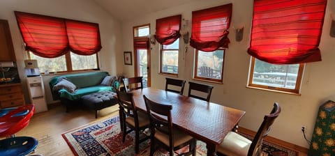 Living area with dining room and reading nook.