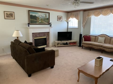 Huge Living Room with Roku TV, Fireplace, 6 Comfy Lounge Seats, Coffee Table, Ceiling Fan (view #1)