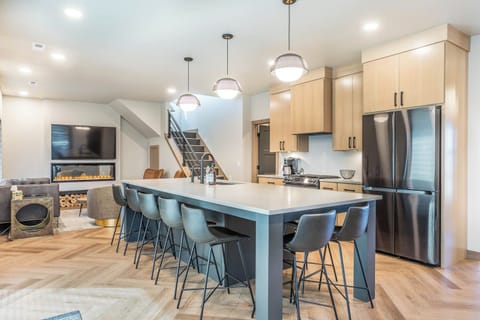 Fully stocked kitchen with island seating for 8 