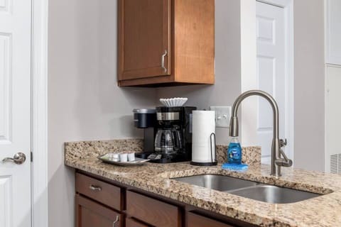 Enjoy a full size sink, Keurig, coffee maker, and well stocked cabinets full of kitchen ware. 