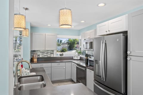 Stainless appliances and coastal finishes