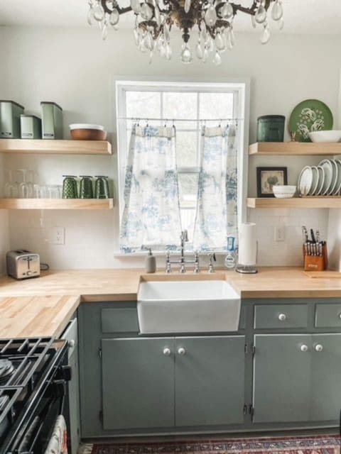 Love this counterspace, butcher block complete with a farmhouse sink!