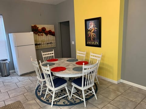 Enjoy your morning coffee or a group meal at the colorful dining table.