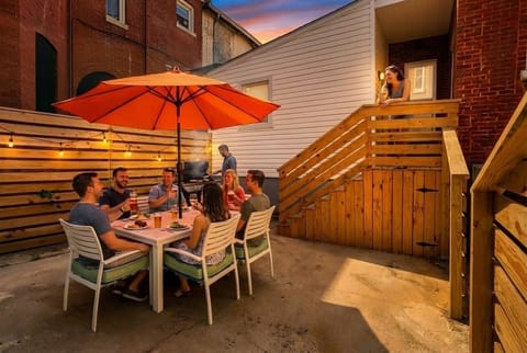 Fire up the grill and enjoy drinks under the umbrella on the patio.