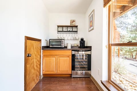 Coffee bar with k-cups, creamer, and sugar that are provided for your coffee needs. Along with a wine fridge and large toaster oven big enough to cook a pizza