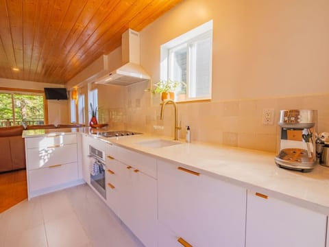 Stainless steel appliances and a white kitchen.