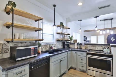 Microwave, mixer, blender, toaster, all essentials provided for entertaining.