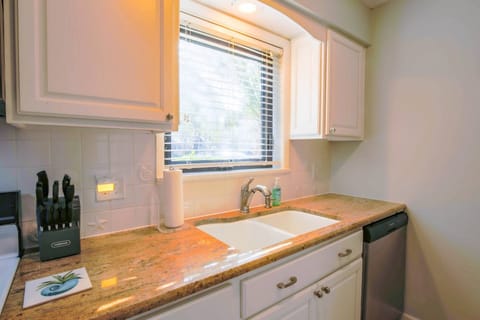 The galley kitchen looks out onto the front side of the building.