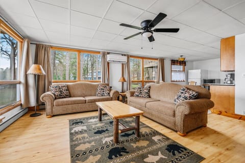 Living Room: Sun-soaked space with beautiful views, perfect for relaxation and family time!