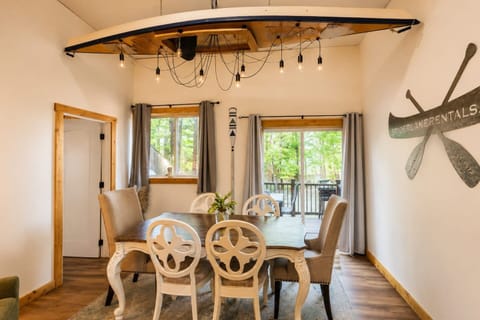 Kitchen & Dining Area: Bright, modern space with a custom kayak chandelier!