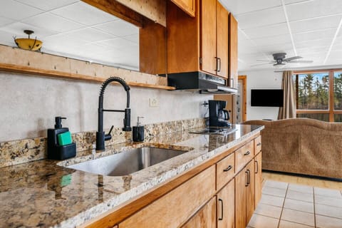 Updated granite countertops and finishes are accented by scenic views of Spider Lake.
