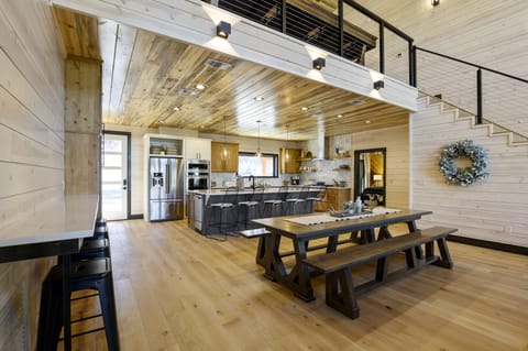 The formal dining table and bar top seating