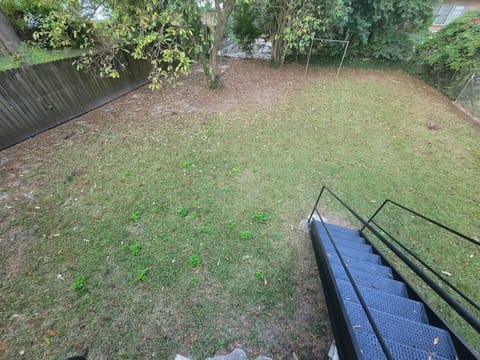 Check out this fenced-in yard! Perfect for the pups and kids