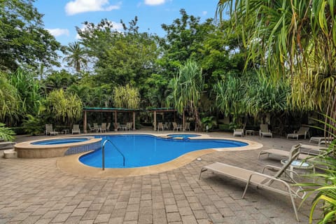 Dive into relaxation with this lush garden and poolside retreat.