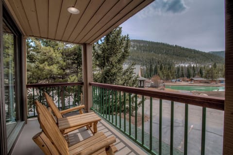 Private balcony with lake and mountain views.