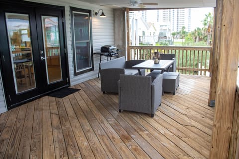 Deck outside of kitchen, dine, play games, sip and chat. View the azure Sound. 