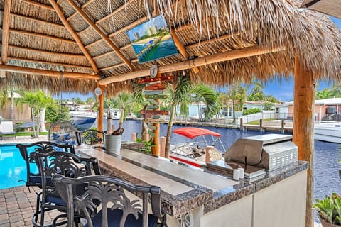 Bar with smart TV, grill & outdoor fridge.