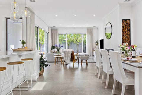 Open living, dining, kitchen into outdoors