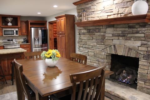 There is a second fireplace in the seating area right off the kitchen. 