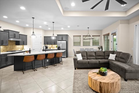 Kitchen & Living Room | Seamless Open Floor Plan Enjoy a modern kitchen and cozy living area, perfect for group gatherings.