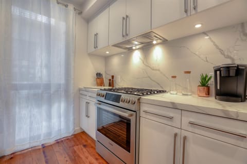 Custom built-in Bosch appliances and open concept dining. 