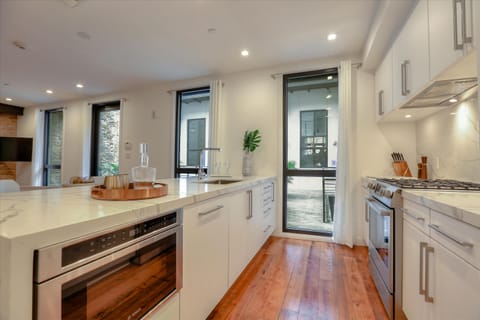 Brand new kitchen with 4cm Calacatta quartz waterfall countertops