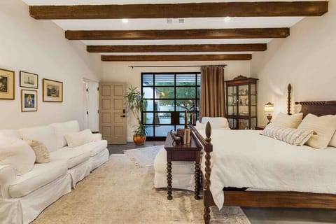 View towards private garden terrace 
Table at the end of the bed, doubles as a desk.  Gesture available upon request.