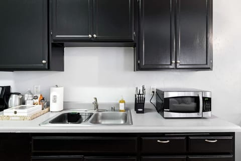 Full Kitchen includes all pots, pans, silverware, coffee maker, coffee, sugar, creamer, tea, blender, toaster, refrigerator, microwave, glasses, wine glasses and cooking/eating utensils