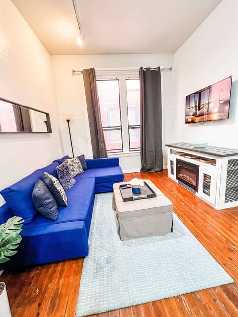 Sit back and relax in the living room area that includes (1) sofa bed and (1) futon as well as a 50-inch ROKU Smart TV 