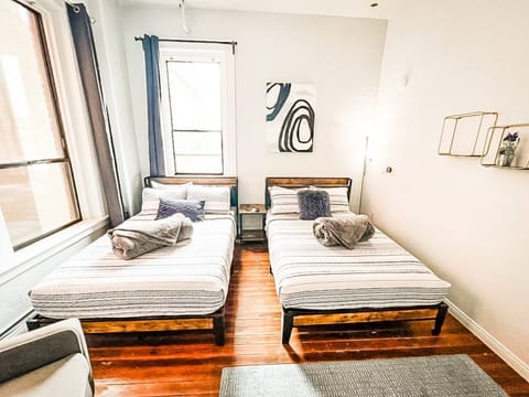 BEDROOM No. 1: Includes (2) Full beds with all pillows, linens and blankets as well as a 50 inch ROKU Smart TV (Central HVAC throughout entire suite)