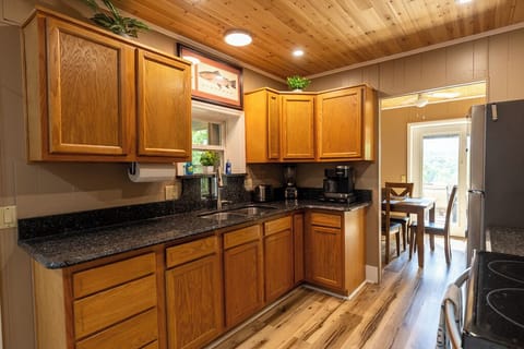 Fully equipped kitchen with stainless steel appliances, granite countertops, and plenty of cabinet space for your stay.