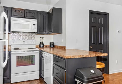 Our kitchen bar is the perfect spot for a quick bite or a chat over coffee, right in the heart of the home."