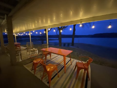 RELAX: The watefront backyard features seating, dining, hammocks, & peace.