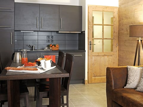 Furniture, Cabinetry, Table, Wood, Kitchen, Countertop, Orange, Kitchen Appliance, Kitchen Stove, Interior Design