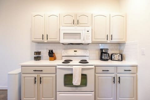 The updated kitchen is well-equipped for home-cooking