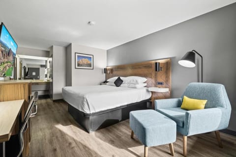 Sink into cloud-soft bedding and relax in the lounge chair.