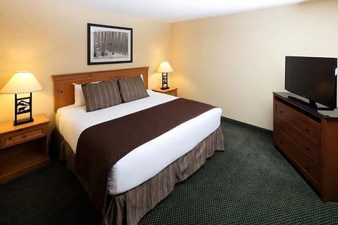 Relax into crisp linens with warm bedside lighting and HDTV.