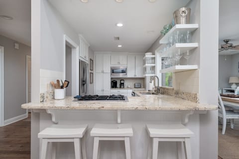 The kitchen has stainless steel appliances, granite counter tops and custom cabinets.  Seating for 3 at the kitchen counter